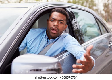 Frustrated African American Male Driver In Car