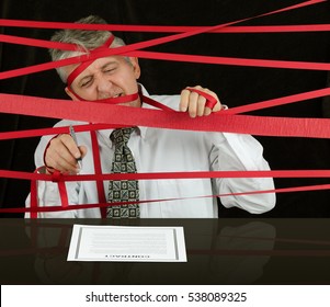 Frustrated Angry Man Caught In Political Bureaucratic Red Tape Regulations As He Struggles To Reach The Contract In Front Of Him Awaiting His Signature So He Can Move Forward With Successful Business