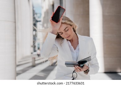 Frustrated Blonde Caucasian Young Businesswoman Walking Eyes Looking Down With Upset Facial Expression Touching Head, Tired, Having Financial Troubles. Beautiful Swedish Woman Having Headache Outdoors