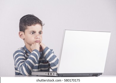 Frustrated Boy In Front Of A Laptop Computer