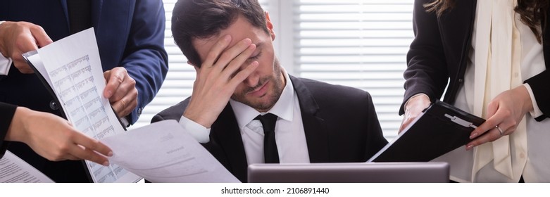 Frustrated Business Employee In Office Under Pressure. Boss Stress