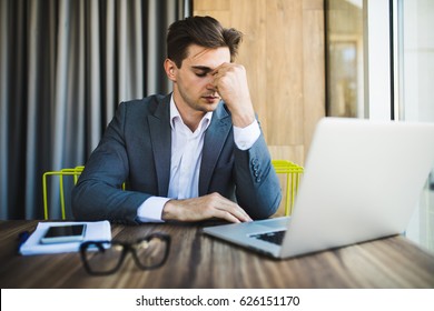 Frustrated Business Man Working On Laptop Computer At Office