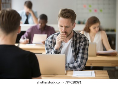 Frustrated Businessman Thinking Solving Problem Working On Laptop In Co-working, Puzzled Worker Or Programmer Concerned About Computer Task Sitting At Desk In Shared Office, Nervous Man Passing Exam