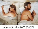 Frustrated couple, bed and argument above with fight, disagreement or erectile dysfunction at home. Top view of man and woman in toxic relationship, breakup or divorce from affair in bedroom at house