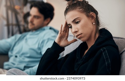 Frustrated couple, headache and fight on sofa in divorce, disagreement or conflict in living room at home. Man and woman in toxic relationship, cheating affair or dispute on lounge couch at house