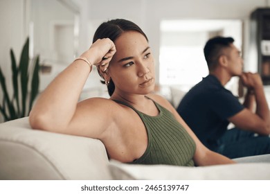 Frustrated couple, headache and ignore with fight on sofa for breakup, conflict or disagreement in living room at home. Upset or young woman and man in divorce, separation or argument at the house - Powered by Shutterstock