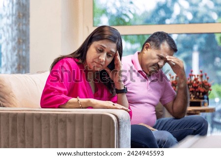 Frustrated couple on couch in conflict, crisis and problem of drama, bad marriage or emotional anxiety