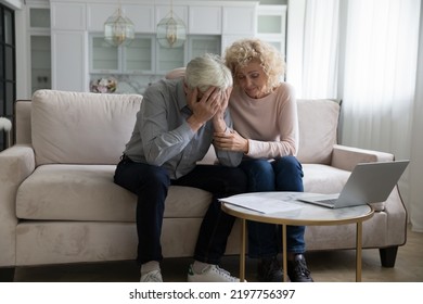 Frustrated desperate mature couple getting bad news, bank, eviction notice, medical test result, touching head, covering face, giving support, empathy, comfort. Sharing problems - Powered by Shutterstock