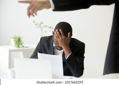 Frustrated Despondent African American Office Worker Getting Fired From Job Concept, White Boss Dismissing Depressed Sad Terminated Black Employee Holding Notice, Unfair Racial Discrimination At Work