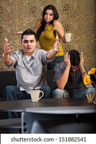 Frustrated Latino Family Indoors In Front Of Television Together