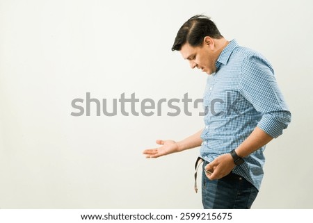 Frustrated man experiencing erectile dysfunction, showing signs of anxiety and stress while seeking medical help from a urologist in a healthcare setting