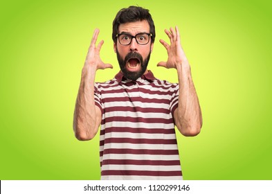 Frustrated man with glasses on colorful background