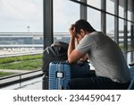 Frustrated man at Narita airport, annoyed because his flight was canceled.