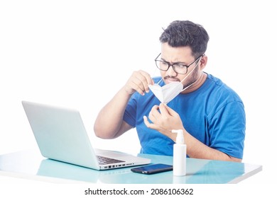 Frustrated Man Remove Mask When Working On A Laptop Or Computer