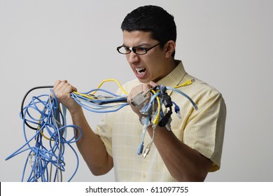 Frustrated Man With Tangled Wires