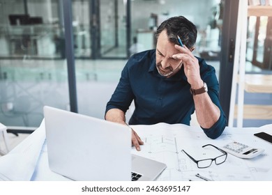 Frustrated, mature man and architect with headache from building planning problem with laptop and blueprints. Senior, male engineer and computer with documents for panic, stress at design mistake - Powered by Shutterstock