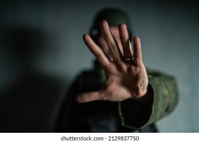 Frustrated Military Soldier Showing Hand To Stop The War.