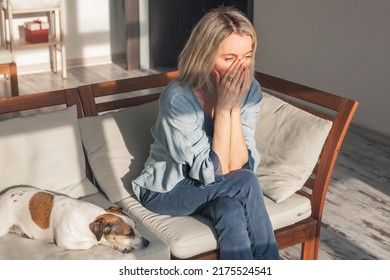 Frustrated Nervous Sad Middle Aged Woman Sitting On Sofa, Touching Forehead, Suffering From Headache Alone At Home. Worried Stressed Adult Female At Home