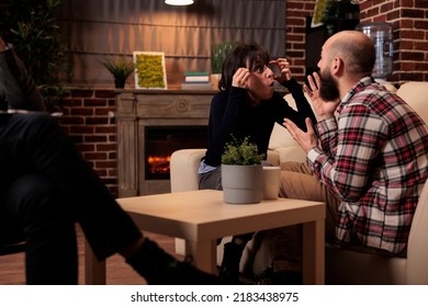 Frustrated People Fighting At Couple Therapy Session With Specialist, Having Argument About Marriage Difficulties. Trying To Solve Relationship Issues With Professional Advice From Therapist.