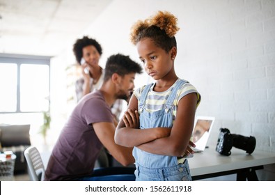 Frustrated Sad Child Looking For Attention From Busy Working Parents