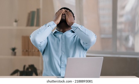 Frustrated shocked african businessman american adult man student work on computer make error mistake feels stress upset with bad news failure e-commerce exam lost internet connection lose online - Shutterstock ID 2188893081
