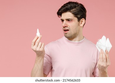 Frustrated Sick Unhealthy Ill Allergic Man Has Red Eyes Runny Stuffy Sore Nose Suffer From Allergy Symptoms Hay Fever Hold Paper Napkin Uses Nasal Drops Isolated On Pastel Pink Color Background Studio