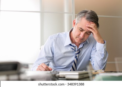 Frustrated stressed business man in an office