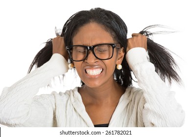 Frustrated stressed woman with glasses. Headshot unhappy overwhelmed girl having headache bad day pulling her hair out isolated white background. Negative emotion face expression feelings perception
