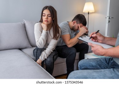 Frustrated wife talking to psychologist sitting on couch with husband, unhappy woman sharing marital problems with counselor, family marriage therapy session, couple counseling concept 