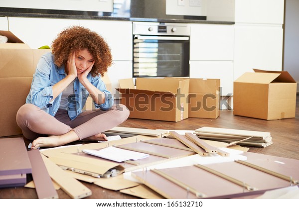 Frustrated\
Woman Putting Together Self Assembly\
Furniture
