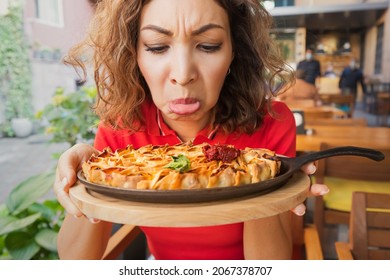 A Frustrated Woman In A Restaurant Does Not Feel The Smell And Taste Of Food Because Of The Long Covid Effect Or Because Of A Bad Cook