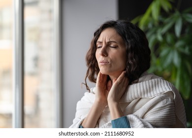 Frustrated Woman Touch Neck Check Glands During Cold, Fever And Seasonal Influenza. Girl Suffer From Painful Throat, Ache, Swallowing Difficulties And Loss Of Voice From Angina Or Coronavirus Illness