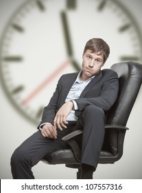 Frustrated Young Business Man Waiting For The End Of The Workday