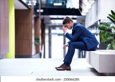 Frustrated Young Business Man Working On Laptop Computer At Office