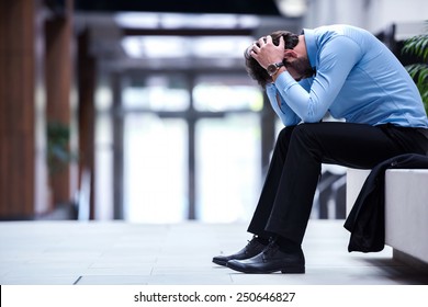 frustrated young business man working on laptop computer at office - Powered by Shutterstock
