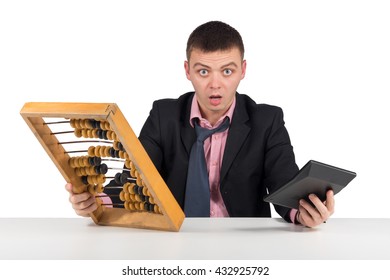 Frustrated young businessman with calculator and abacus  isolated on white background