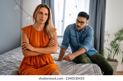 Frustrated young couple arguing and having marriage problems. Divorce conflict people concept - Shutterstock ID 2340530433