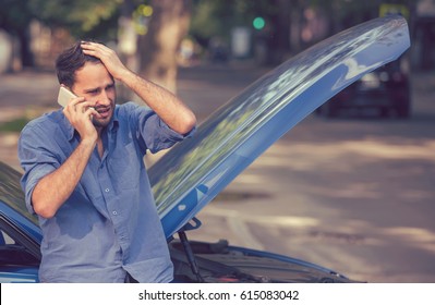 Frustrated Young Man Calling Roadside Assistance After Breaking Down. Long Waiting Time Concept 