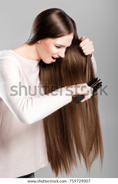 Frustrated Young Woman Combing Tangled Long Stock Photo Edit Now
