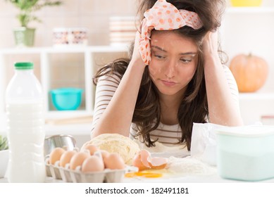 Frustrated Young Woman Making Dough