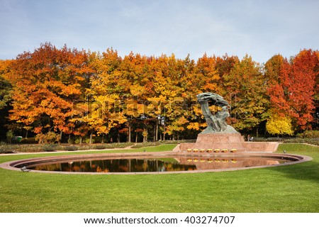 Fryderyk Chopin monument and pond in autumn Royal Lazienki Park in Warsaw, Poland