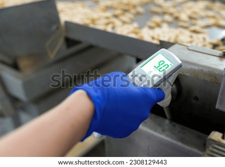 Fryer oil tester. Checking the level of carcinogenic in the oil industrial production. The green color symbolizes good quality
