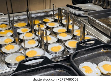 Frying Eggs at Hotel Breakfast Buffet
