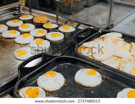 Frying Eggs at Hotel Breakfast Buffet