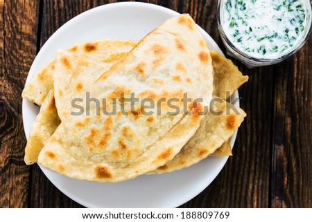 Baked Cheburek with Sour Cream-Garlic Sauce on Tray