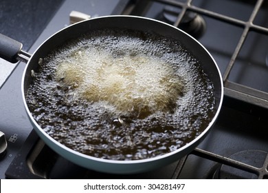 Frying Pan With Boiling Oil On The Stove.