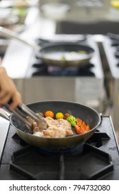 Frying pan cooking chicken