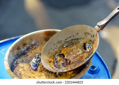 Frying Pan With Holes From Chemical Experiments On Burning Magnesium