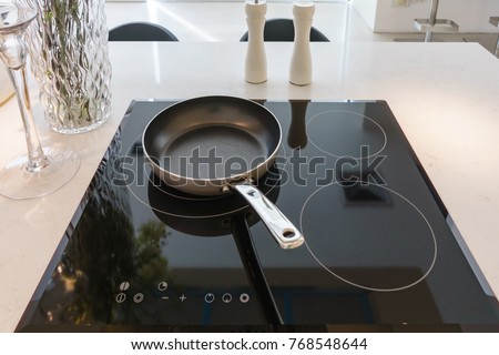 Frying Pan On Modern Black Induction Stock Photo Edit Now