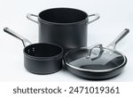 Frying pan and pots set with handles isolated on white studio background